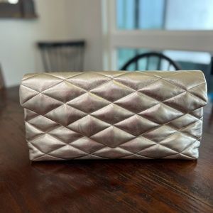 SAINT LAURENT Sade Puffy Quilted Leather Clutch-Plantino